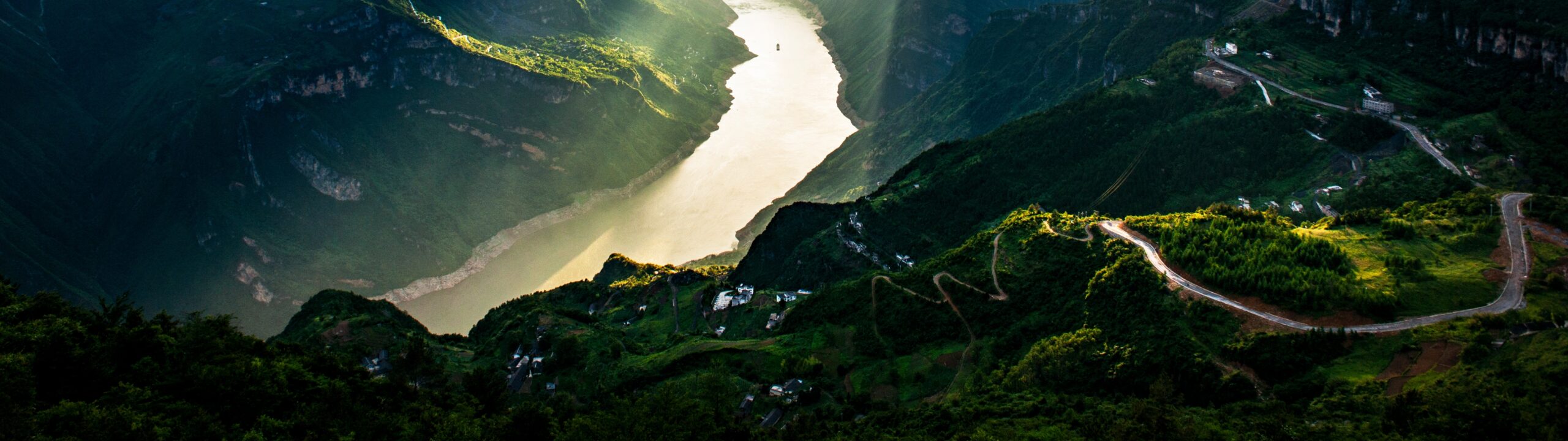 Sunlight over the Yangtze River and mountain landscape in the Three Gorges region